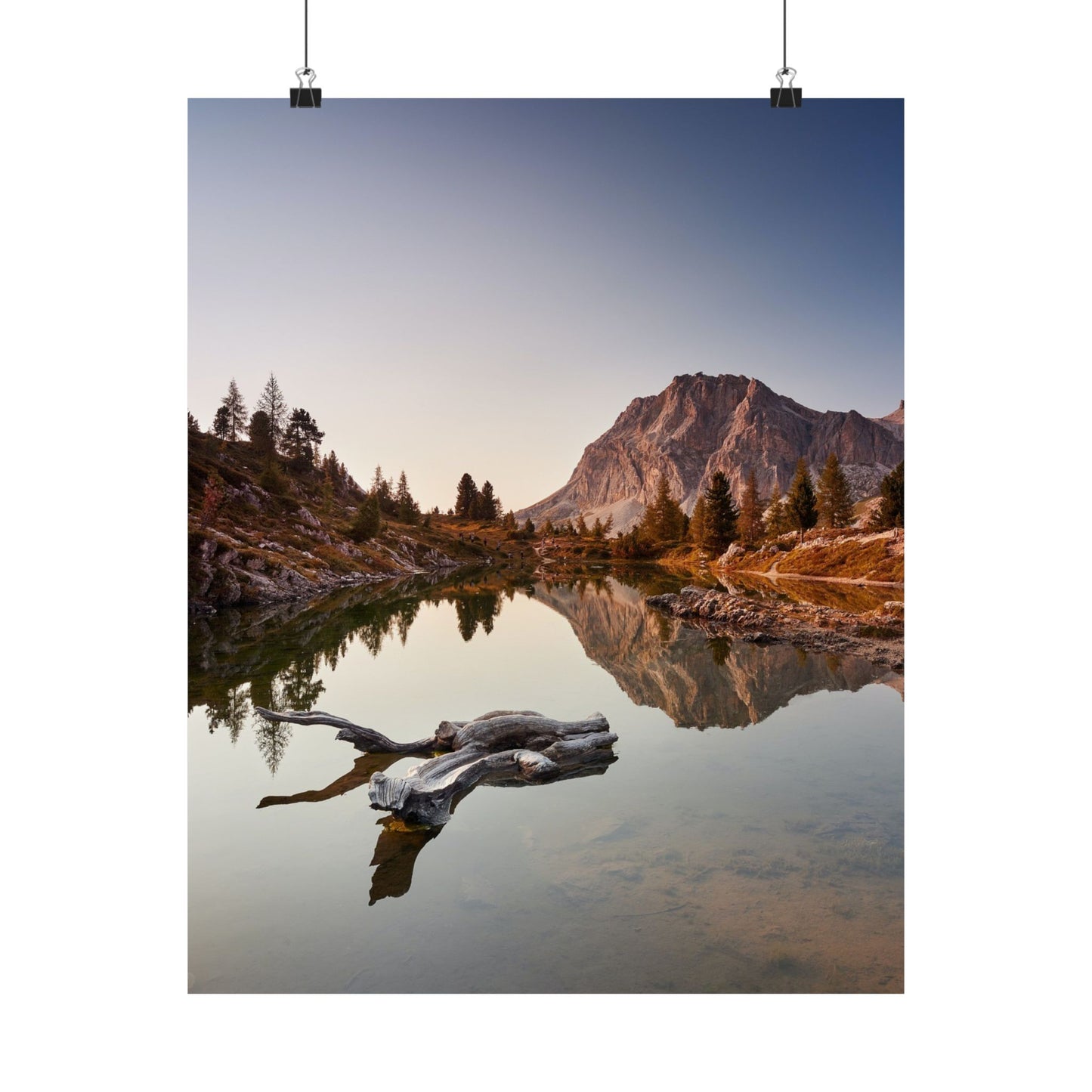 Mountain landscape with a lake and trees at sunset