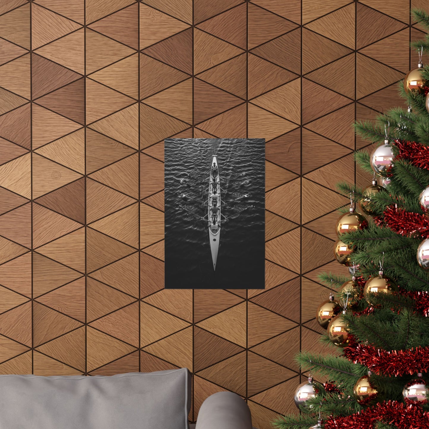 Wooden wall with geometric pattern, framed artwork, and Christmas tree with decorations.