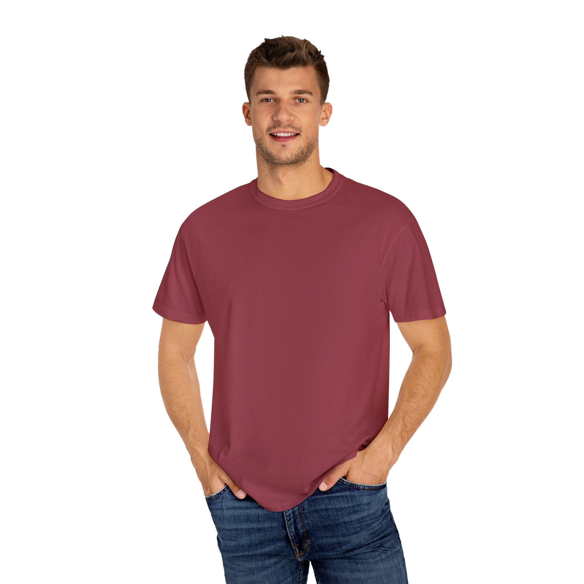 Man wearing a maroon t-shirt and blue jeans on a white background