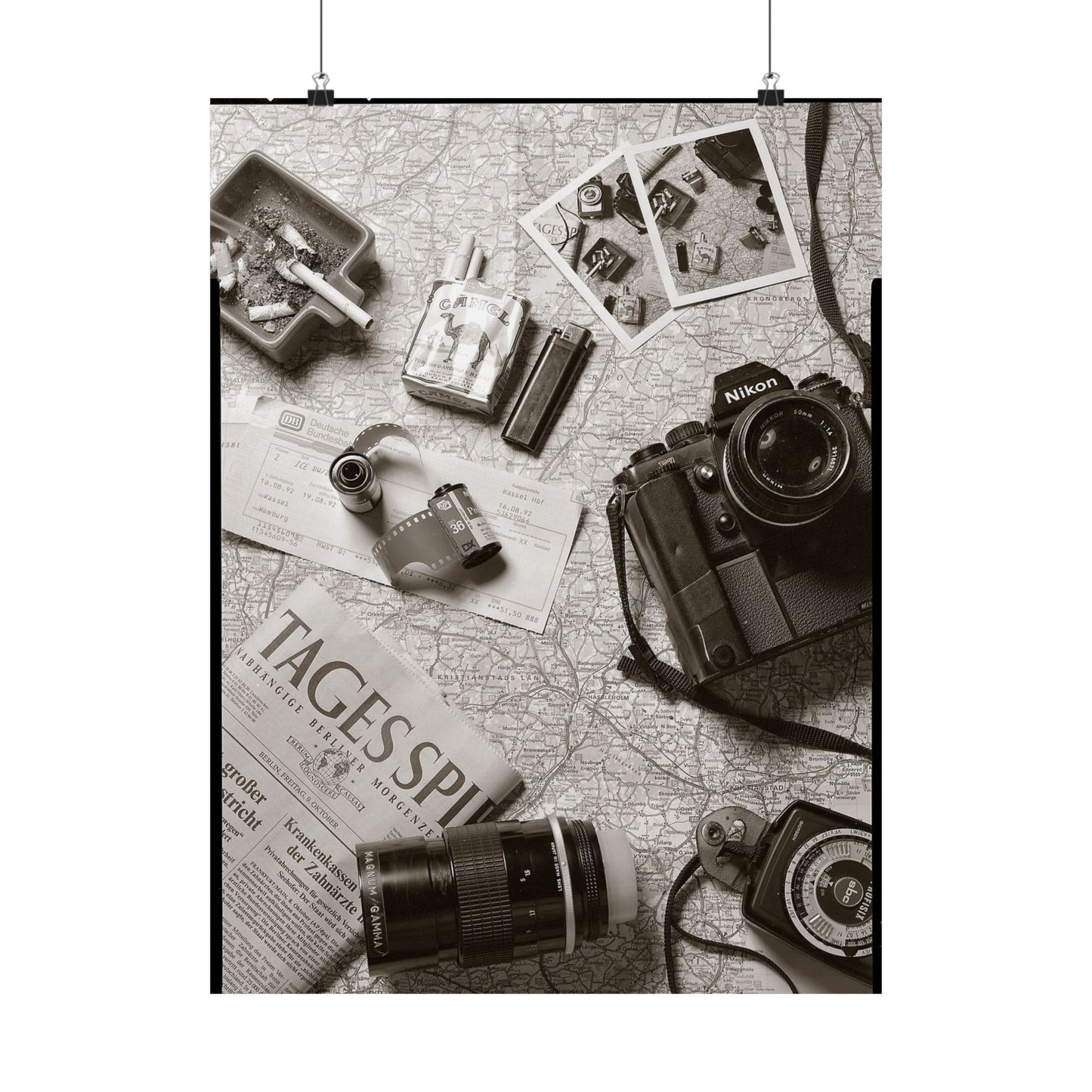 Vintage camera and accessories on a map with 'Tages Spiegel' newspaper