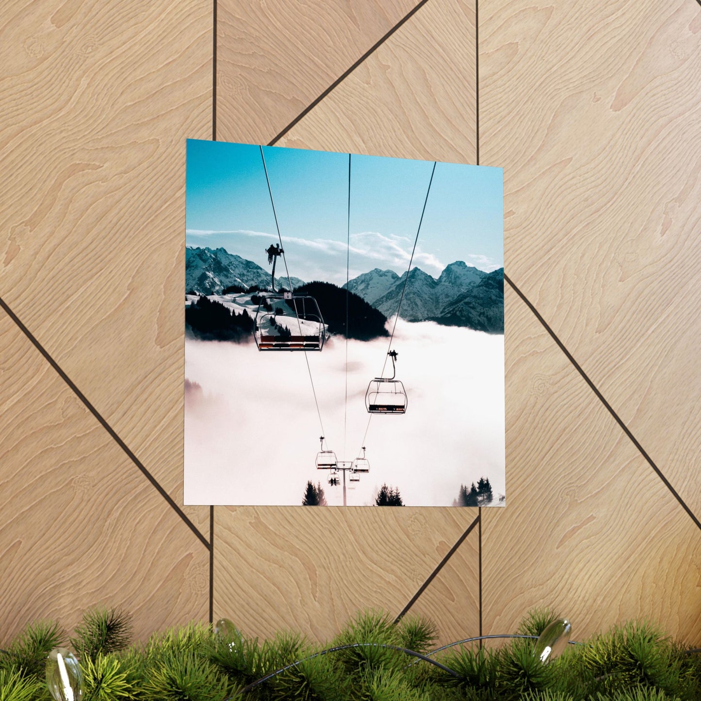 Ski lift with mountains in the background on a wooden surface
