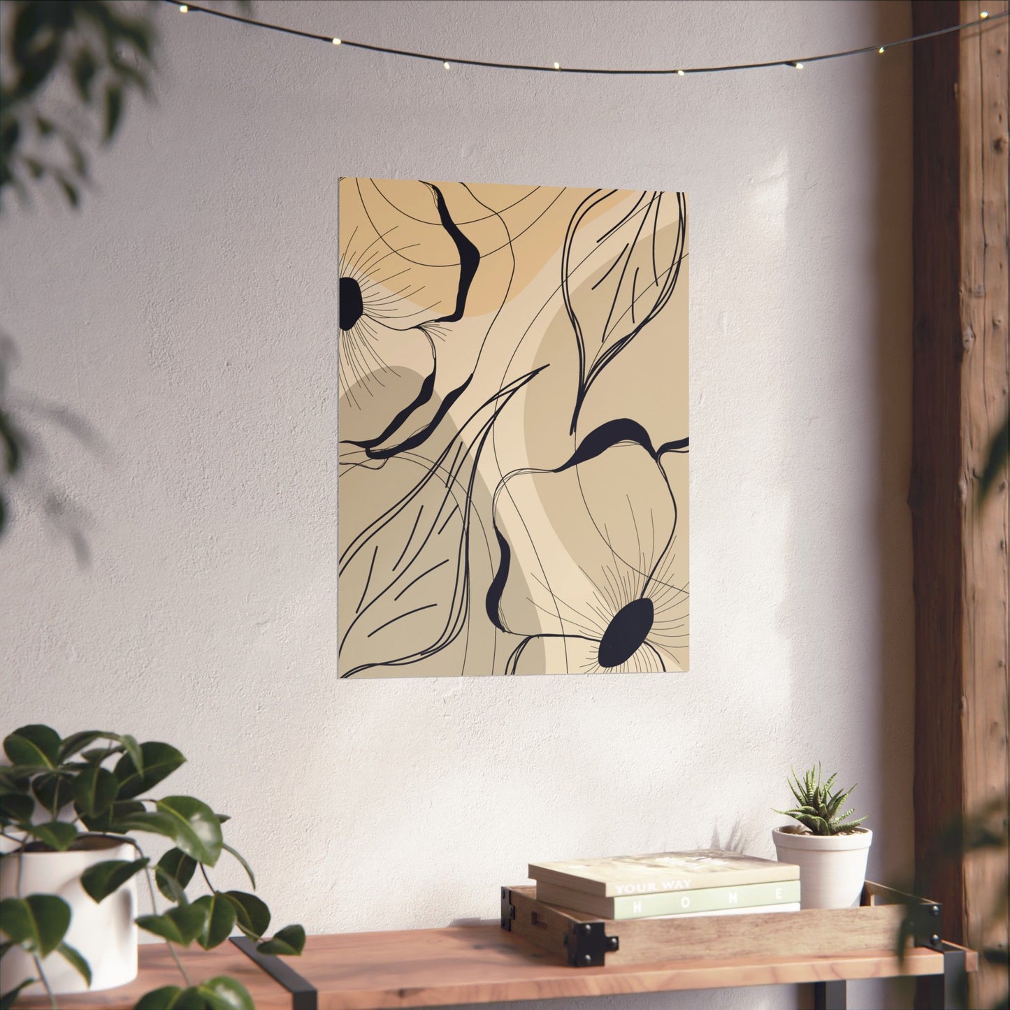 Abstract floral artwork on a wall with a wooden table and plants below