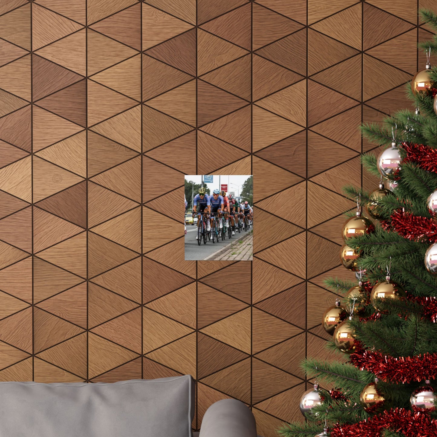 Wooden panel wall with geometric pattern, Christmas tree with decorations, and small inset photo of cyclists.