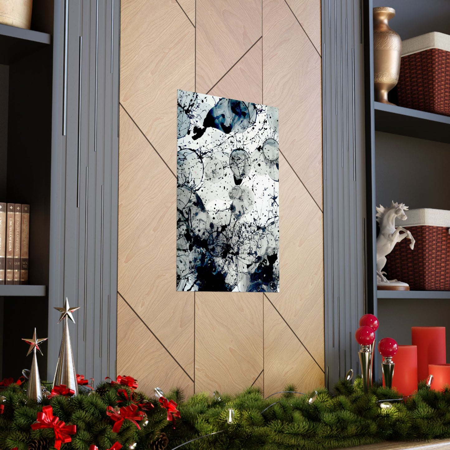 Abstract art piece on a wall with Christmas decorations below