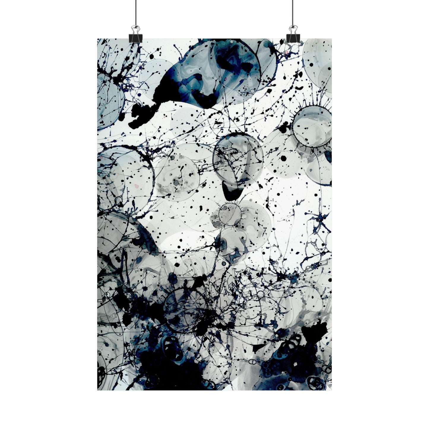 Abstract art print with black and blue splashes on a white background