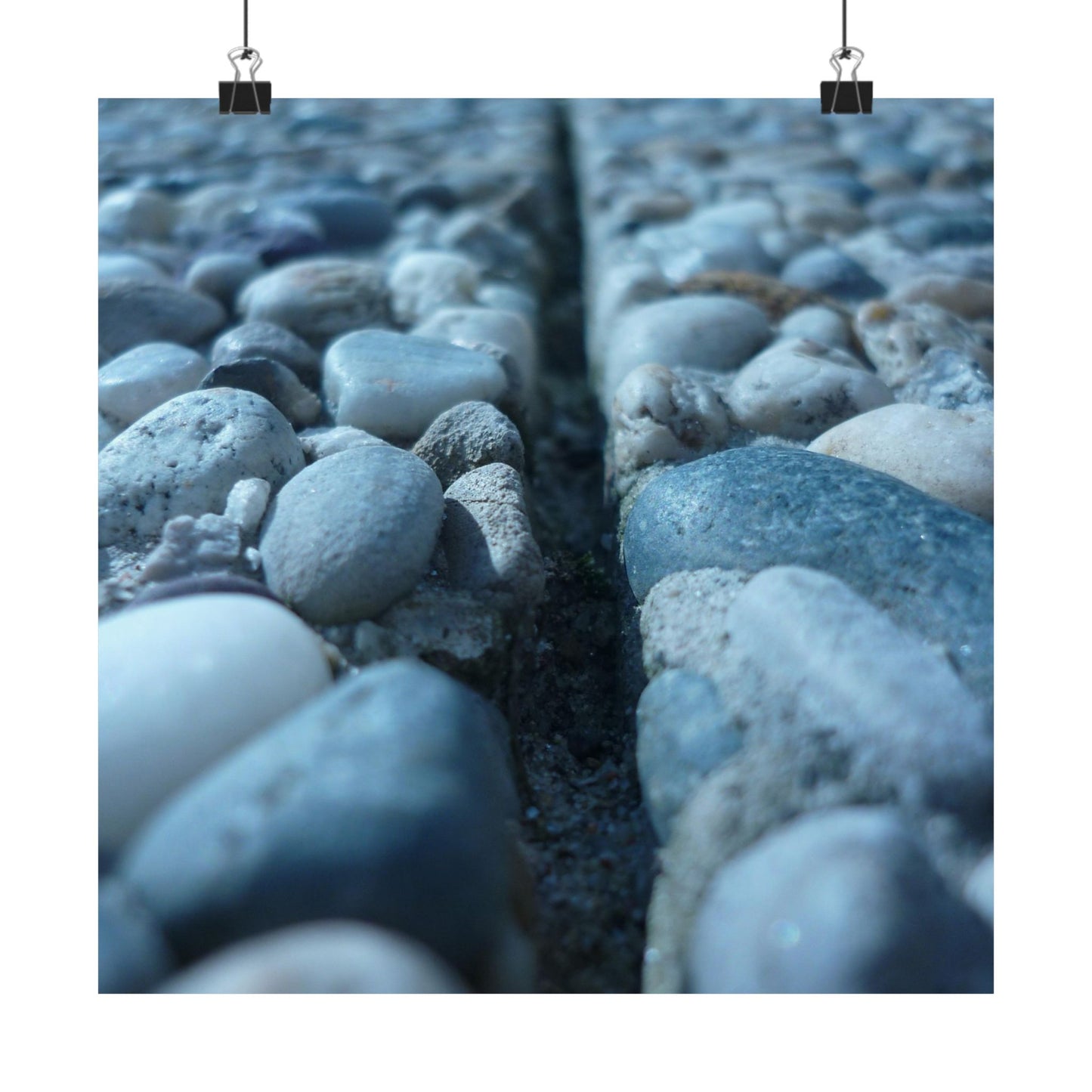 Close-up of pebbles with a crack running through them