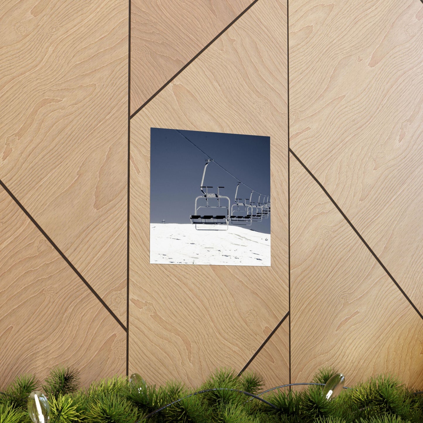 Ski lift chair against a blue sky on a wooden panel background