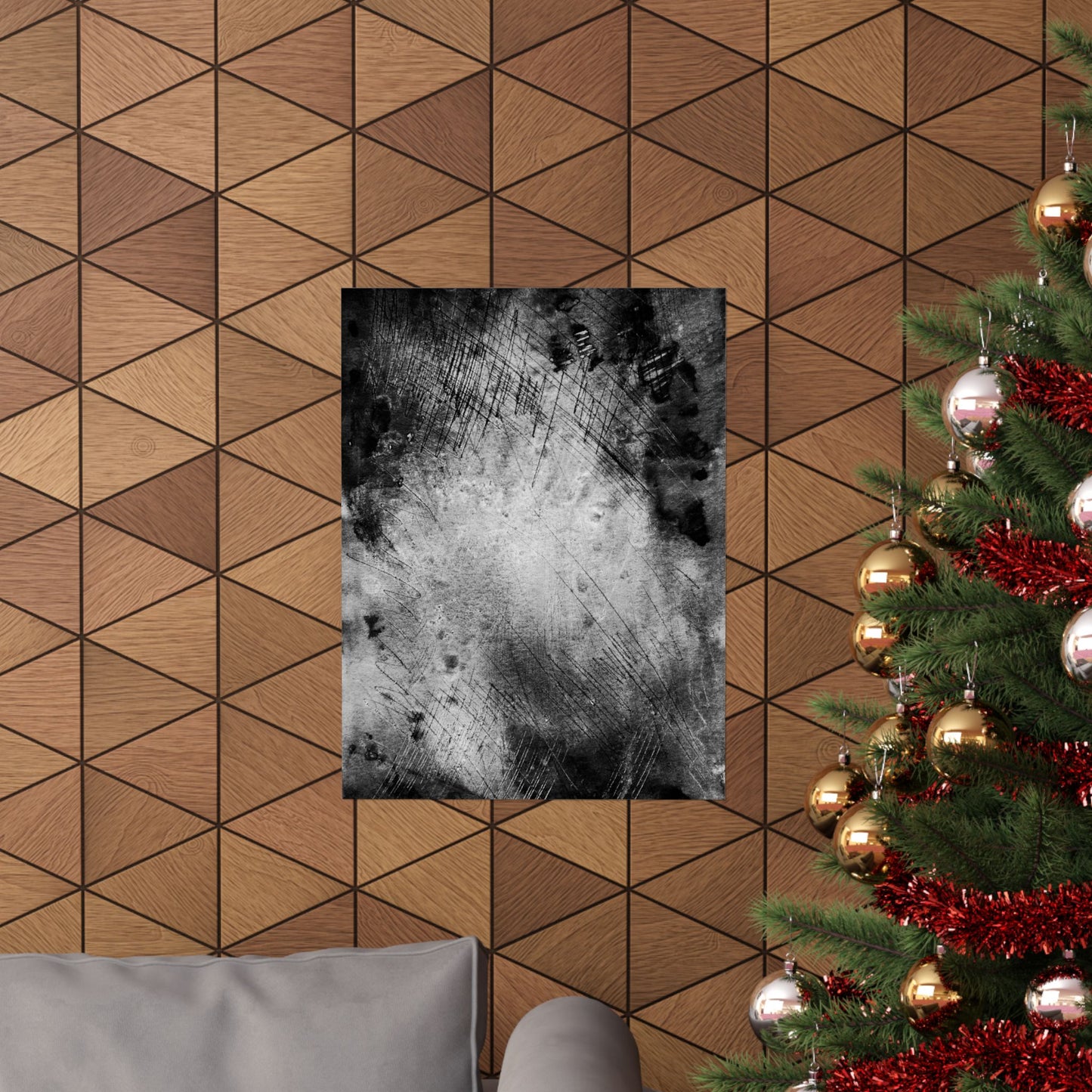 Decorative wall art on a geometric-patterned wall with a Christmas tree to the right.