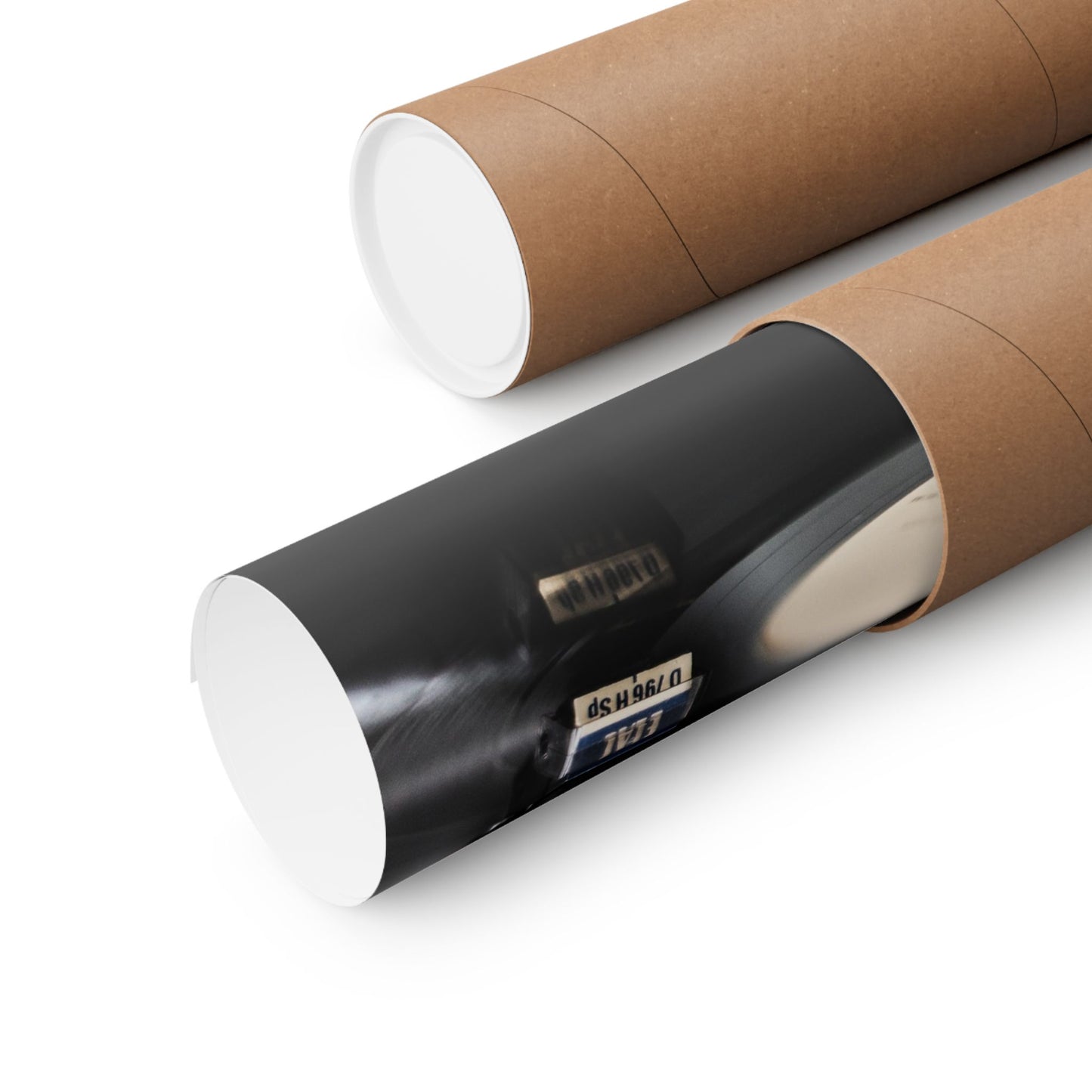 Two cylindrical paper rolls with one partially unrolled on a white background