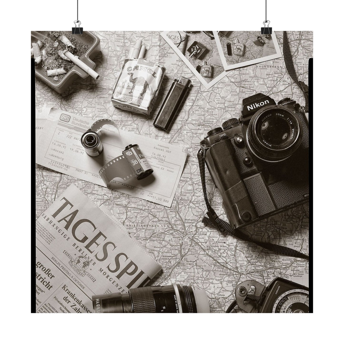Vintage camera and film items on a map background
