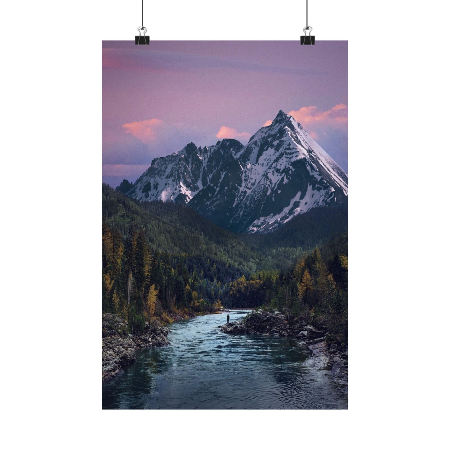 Mountain landscape with a river and snow-capped peaks under a purple sky.