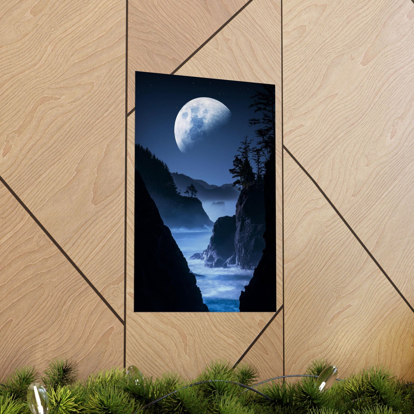 Framed artwork of a moonlit landscape on a wooden wall.