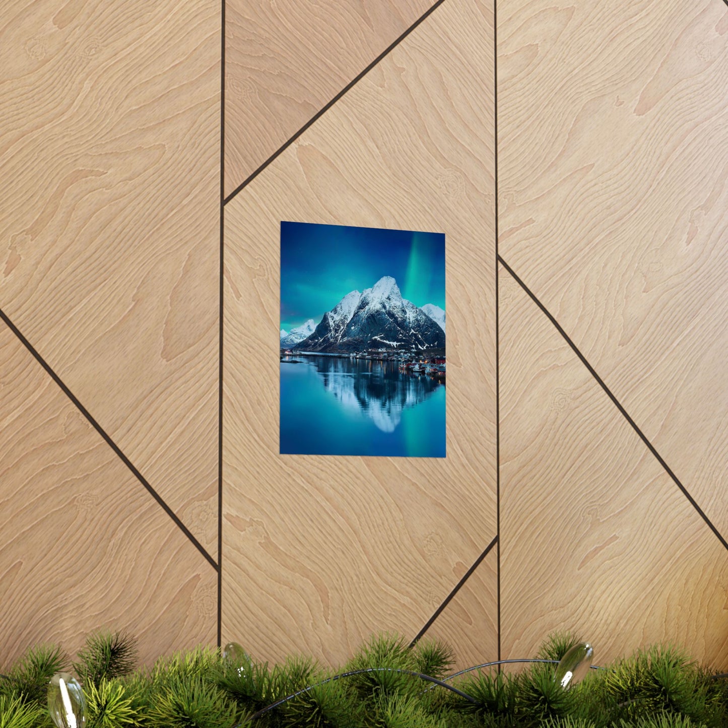 Poster of a mountain landscape with a lake on a wooden wall.