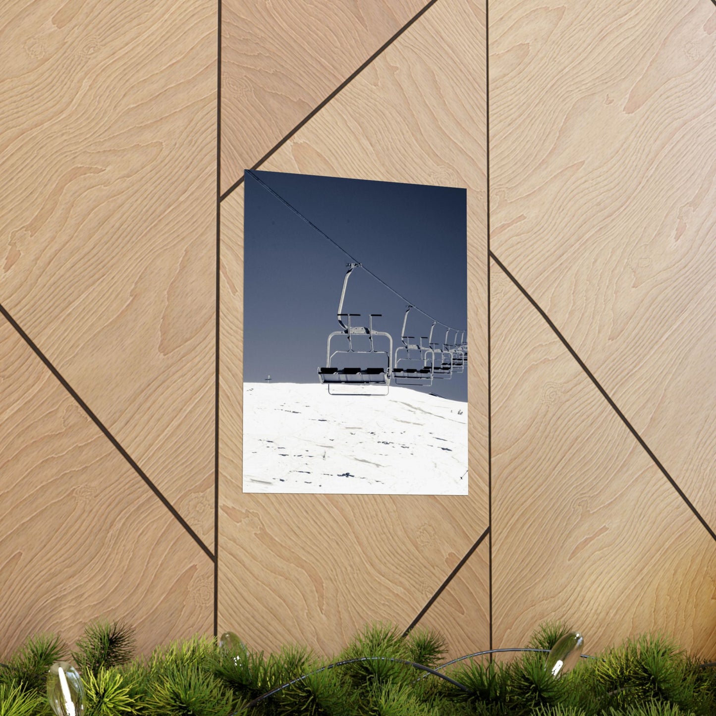 Ski lift against a blue sky on a wooden wall with geometric patterns