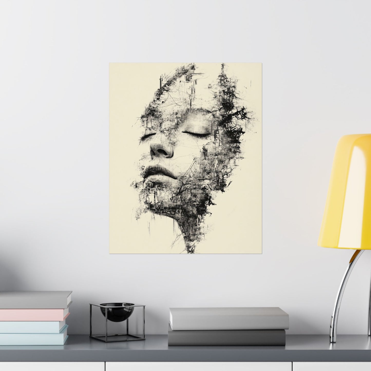 Abstract art print of a face on a beige background in a modern interior setting.