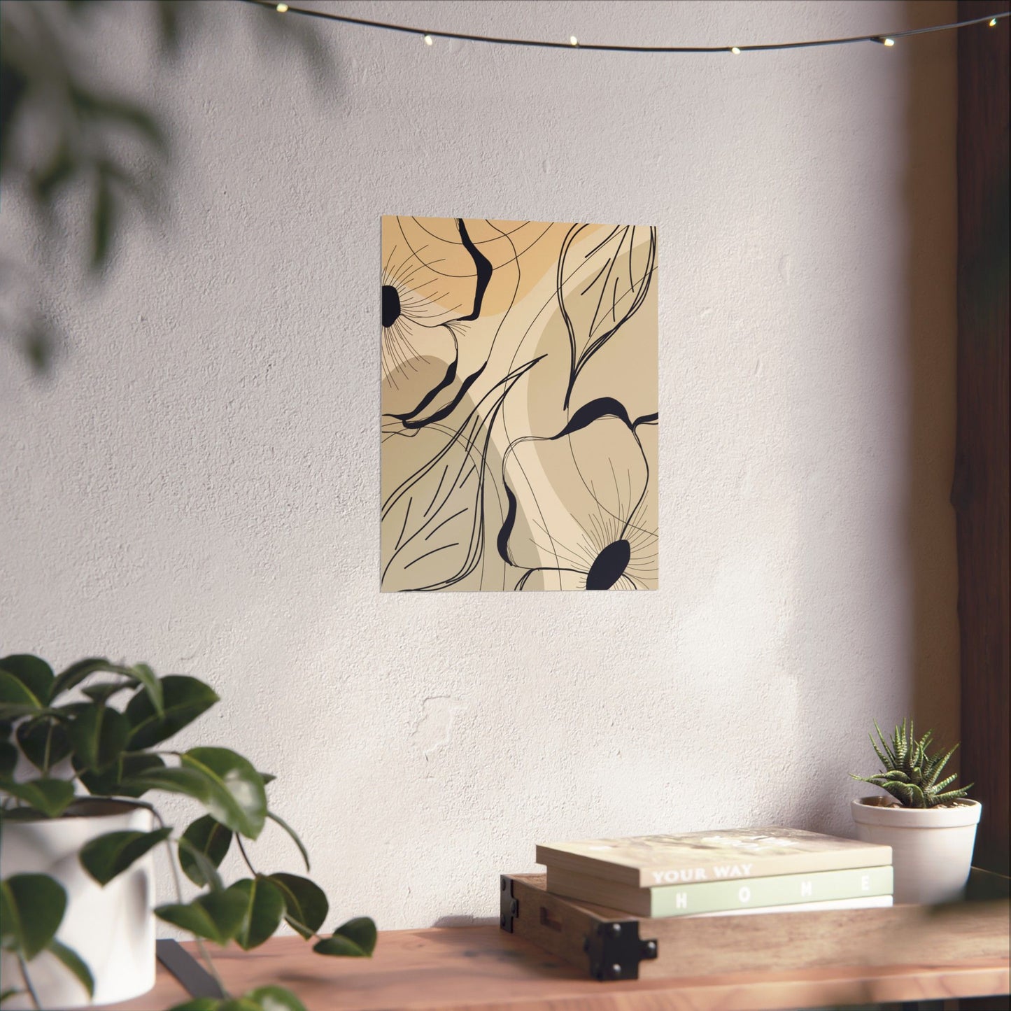 Abstract floral artwork on a wall above a wooden table with plants