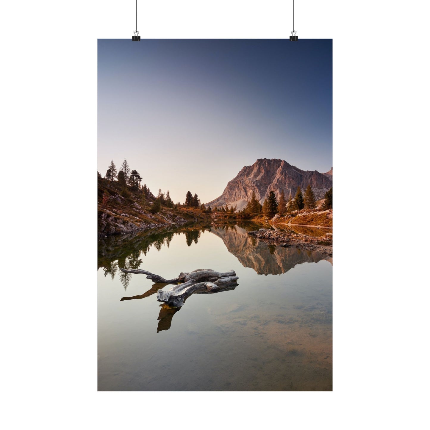 Mountain landscape with a lake and a log in the foreground