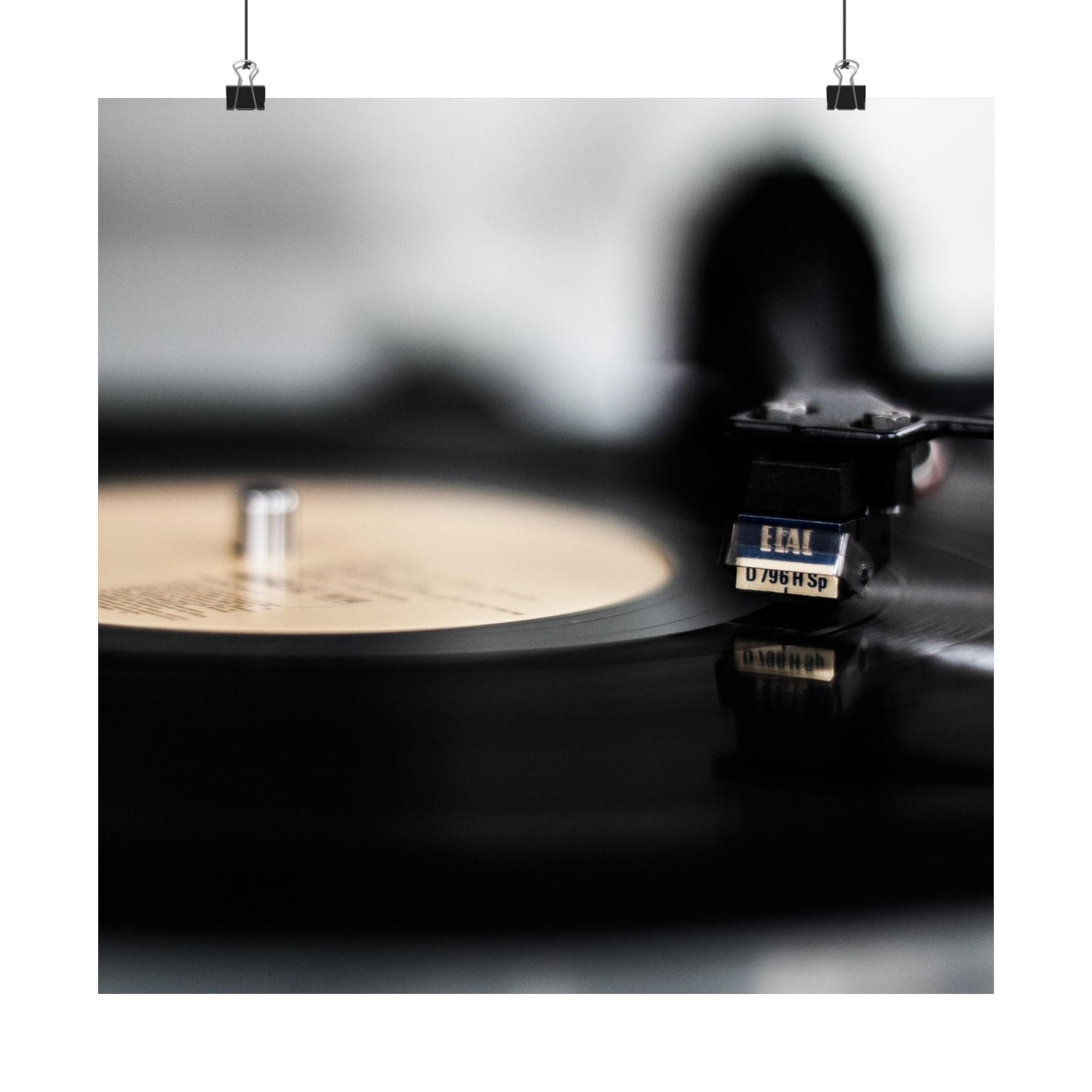 Close-up of a vinyl record and turntable with a blurred background