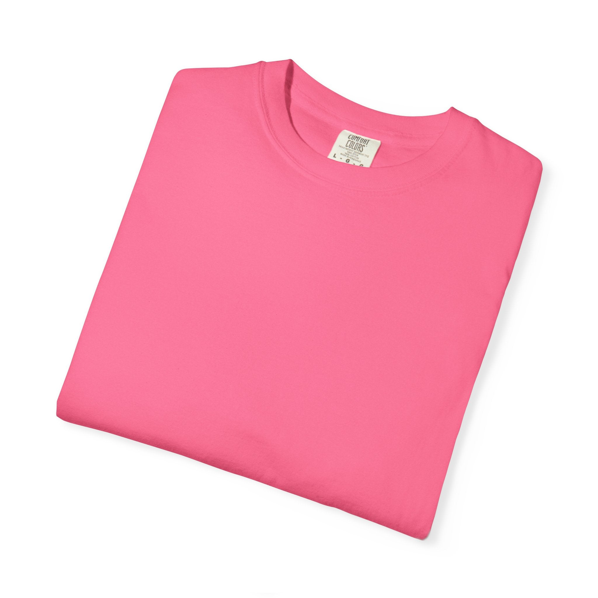 Folded pink t-shirt with a label on a white background