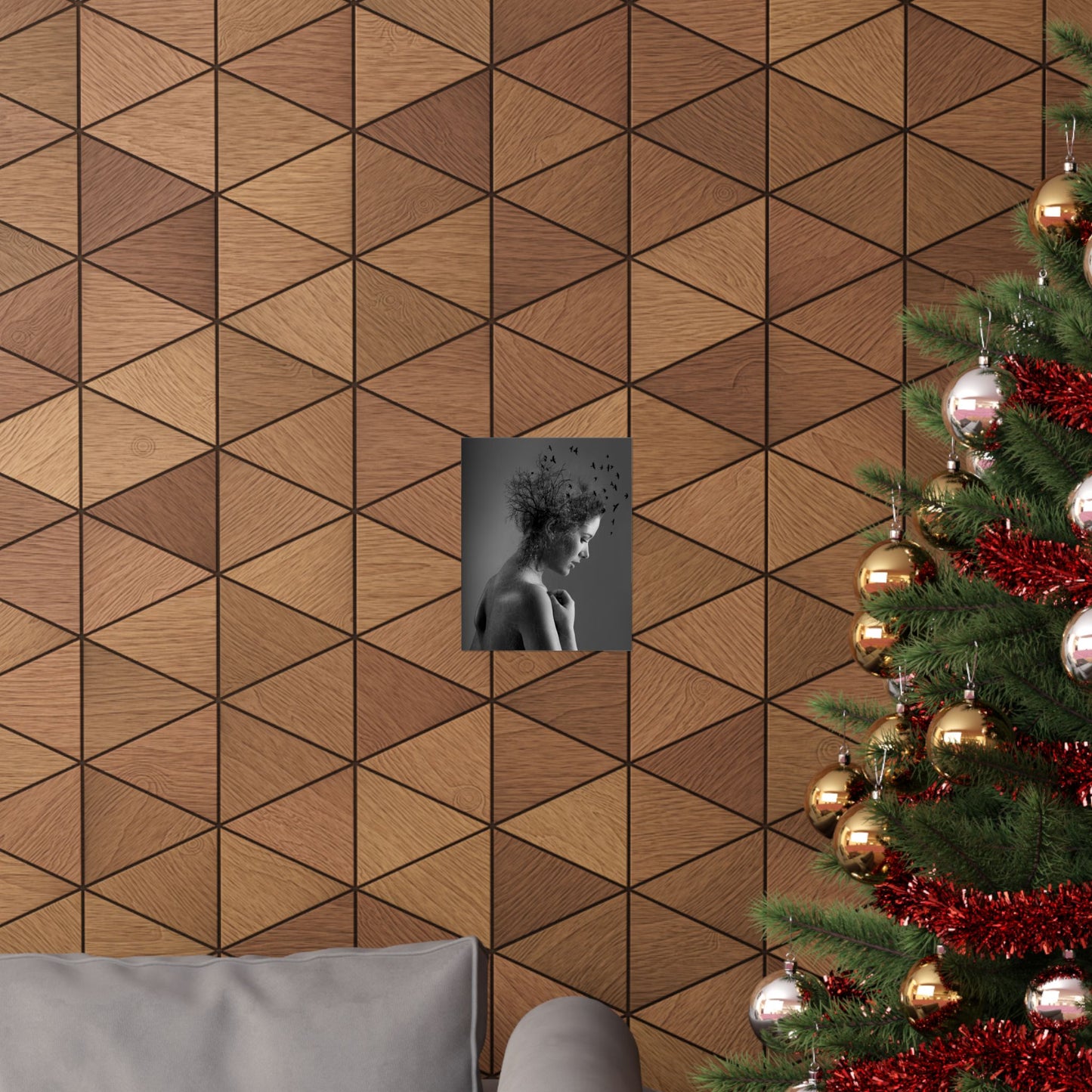 Wooden wall with geometric pattern, framed picture, and Christmas tree with decorations.
