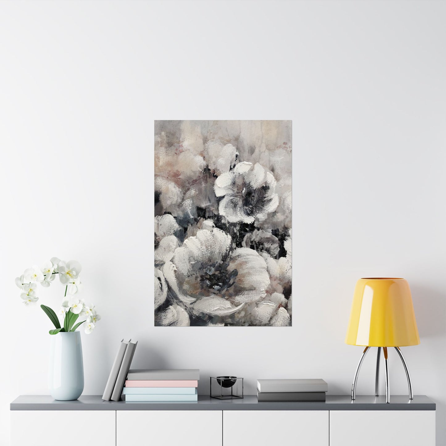 Floral painting on a wall above a table with decor items