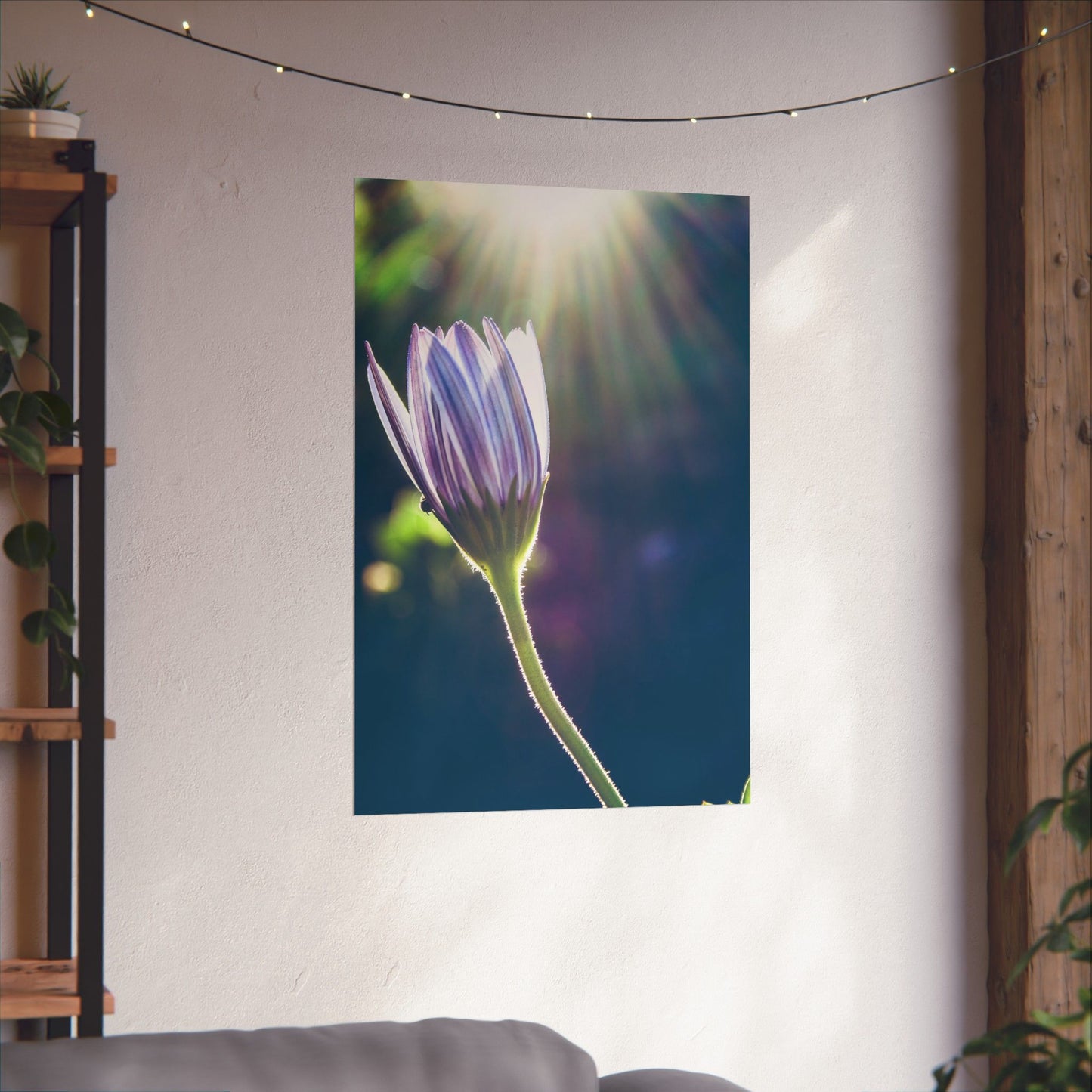 Flower tapestry hanging on a wall with a sunlit background