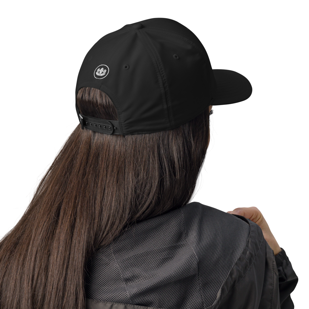 Person wearing a black cap and jacket on a white background
