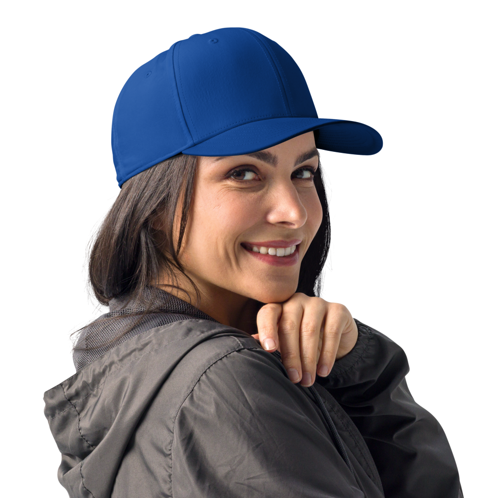Woman wearing a blue cap and gray jacket on a white background