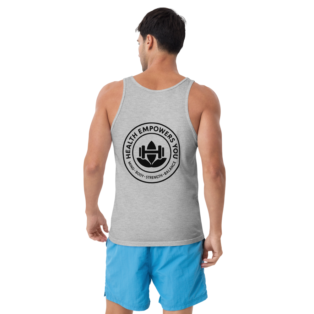Man wearing a gray tank top with a logo and blue shorts on a white background