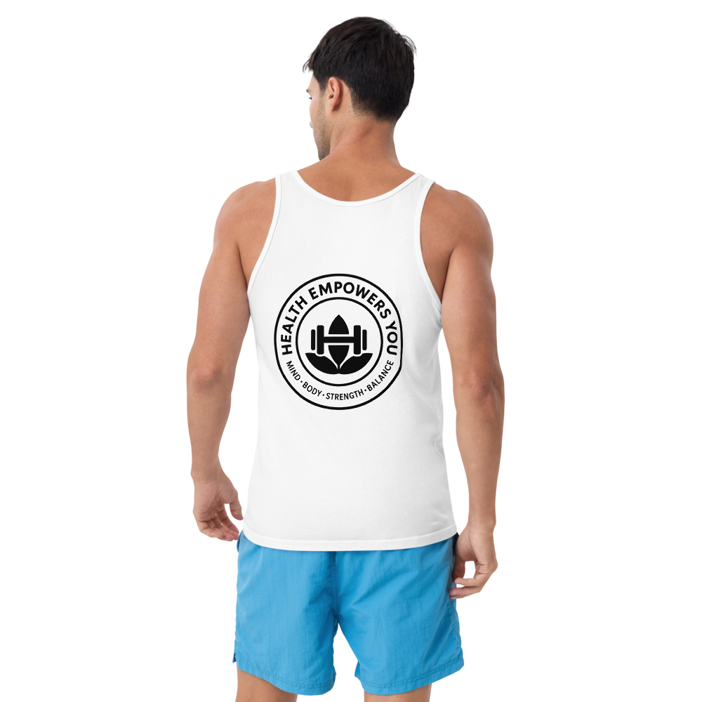Man wearing a white tank top with a black logo and blue shorts on a white background
