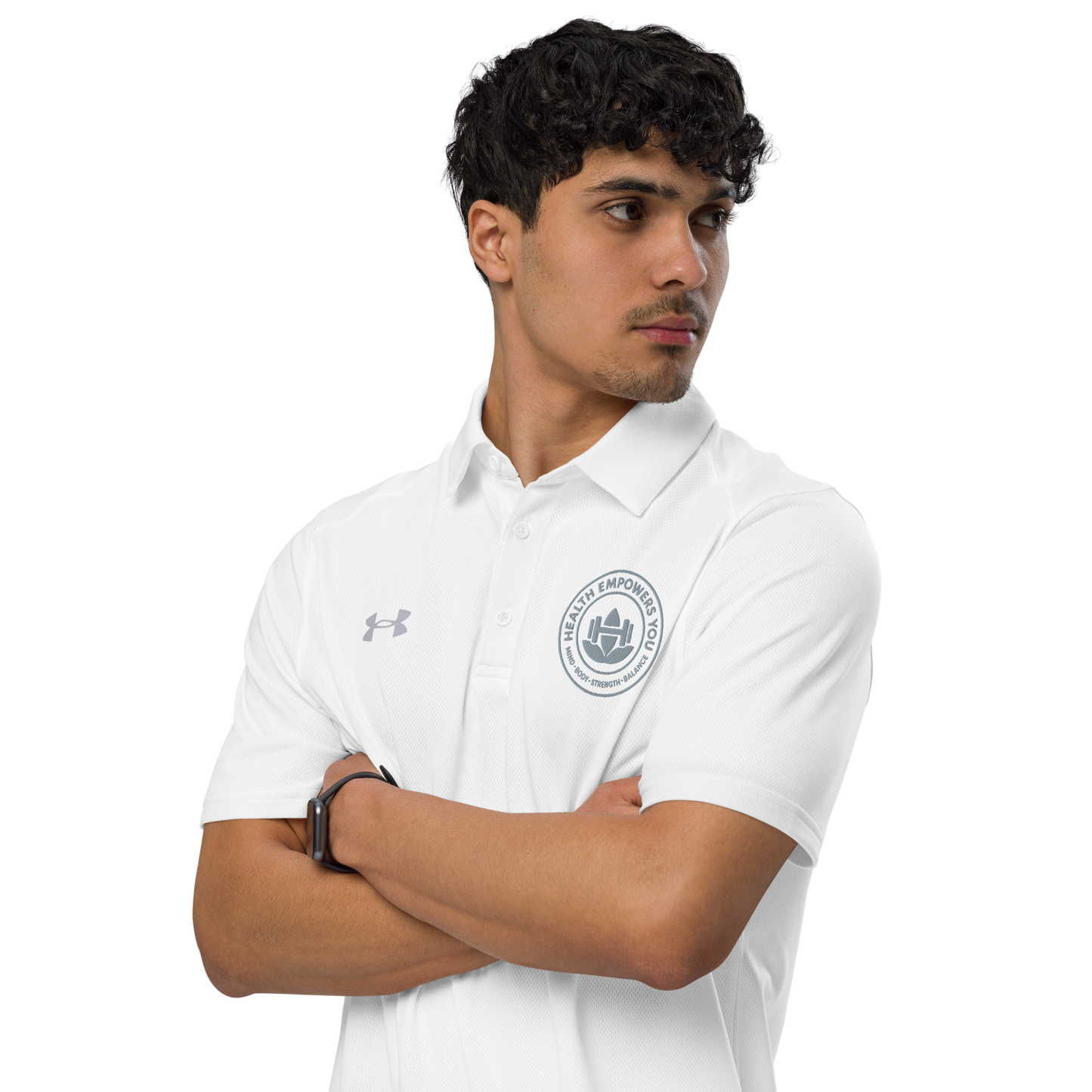 Man wearing a white Under Armour polo shirt with a logo on a white background