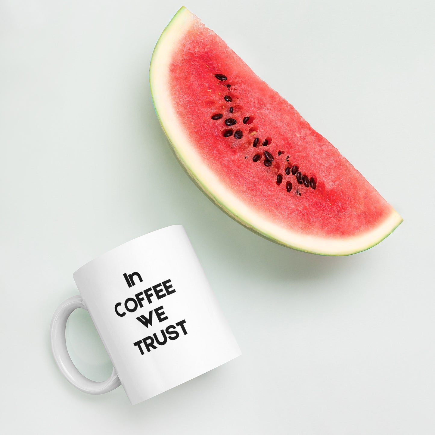 "In Coffee We Trust coffee mug - side view showing humorous caffeine quote"