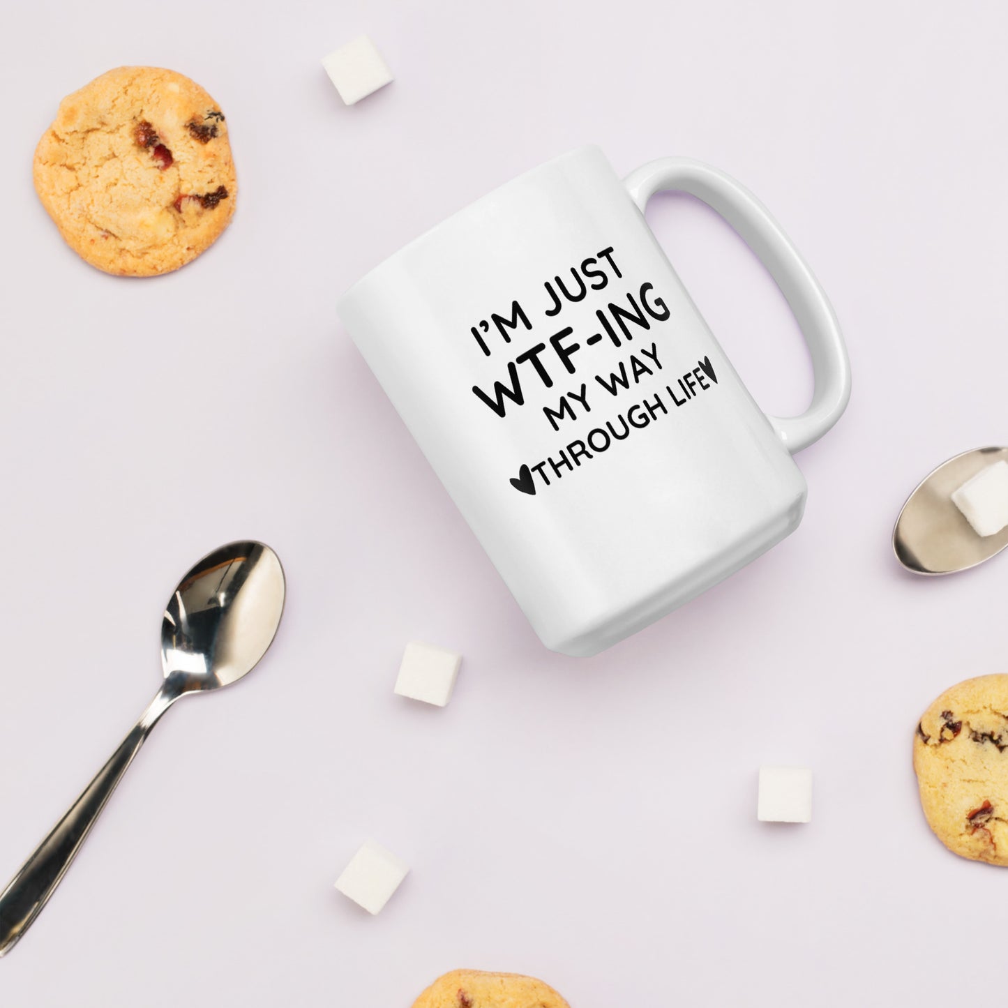 "White ceramic coffee mug with black text saying I'm Just WTF-ING My Way Through Life"