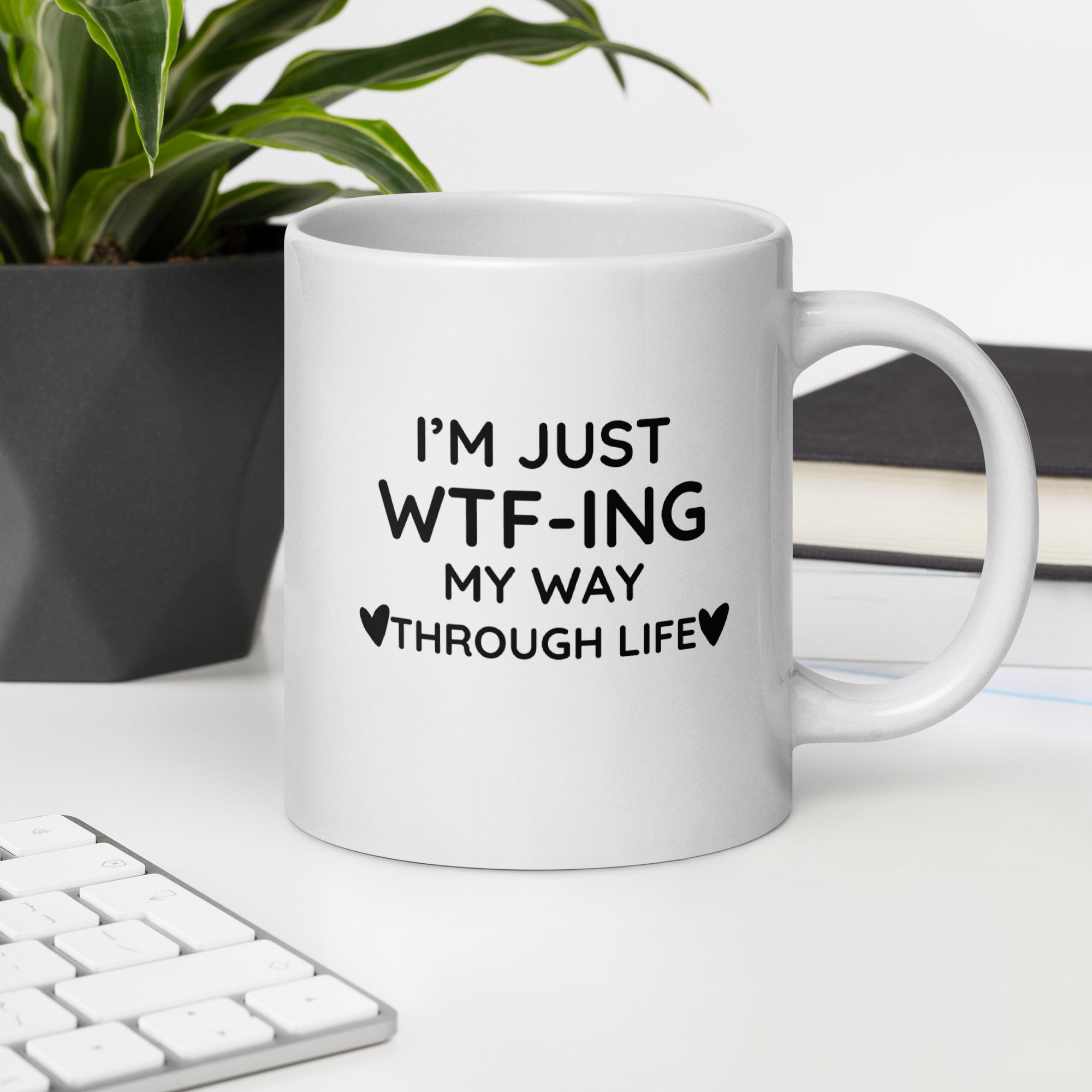 "White ceramic coffee mug with black text saying I&