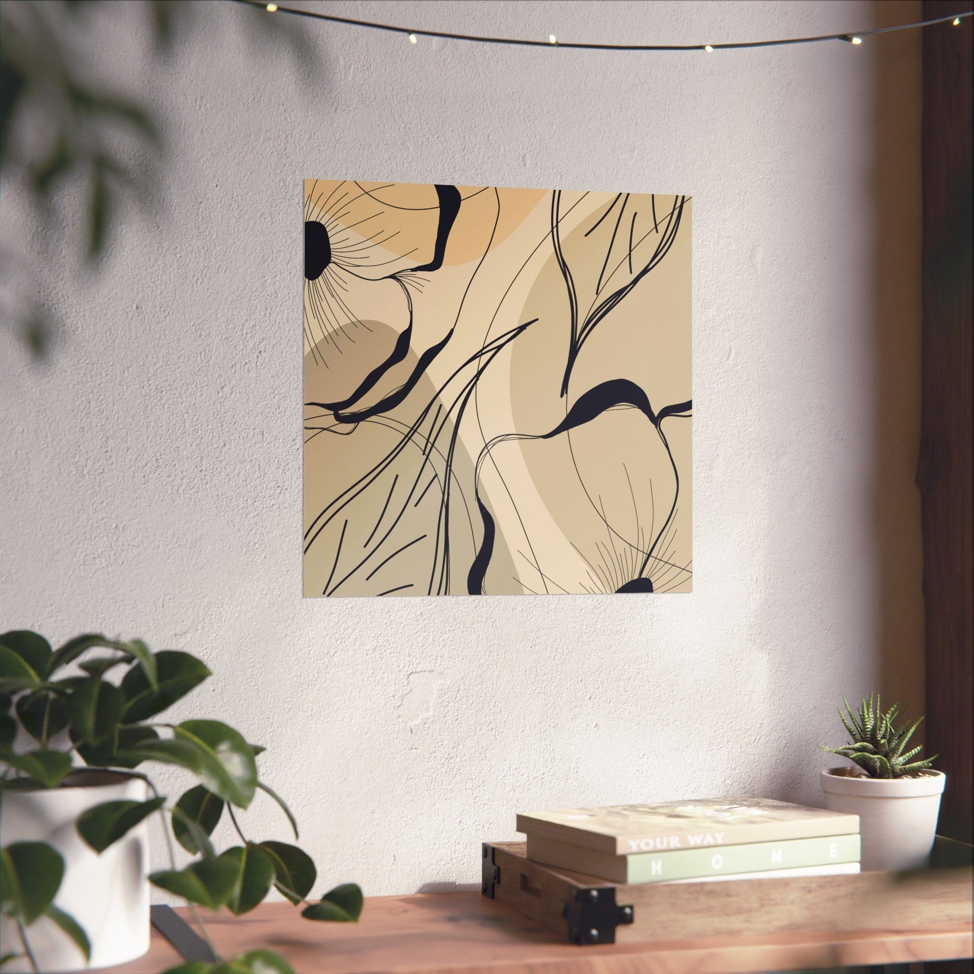 Abstract art print on a wall above a wooden table with plants.