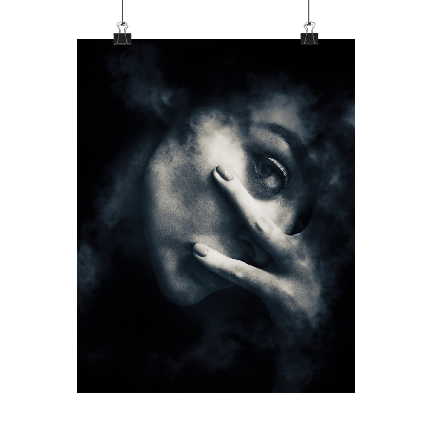 Black and white portrait of a person with a hand covering part of their face, hanging on a wall.