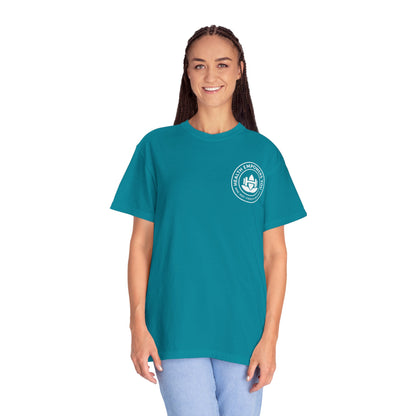 Person wearing a teal t-shirt with a logo on a white background
