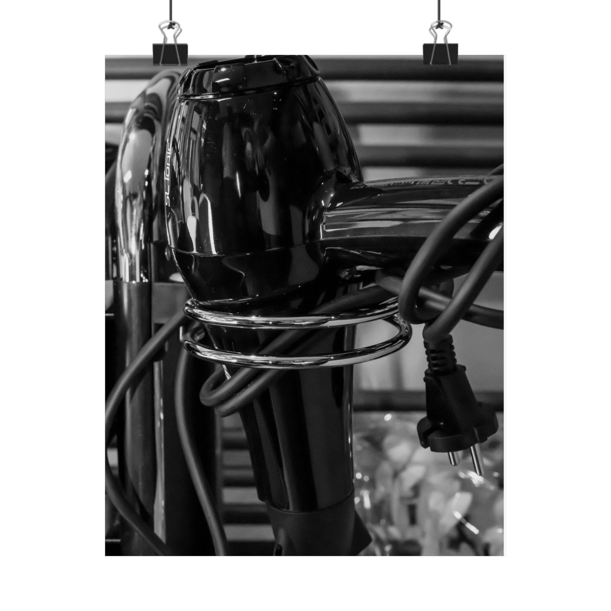 Black hair dryer with multiple attachments on a white background