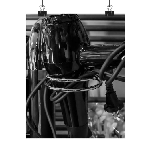 Black hair dryer with multiple attachments on a white background