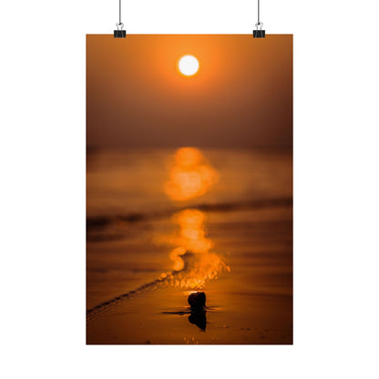 Sunset over water with a small object in the foreground