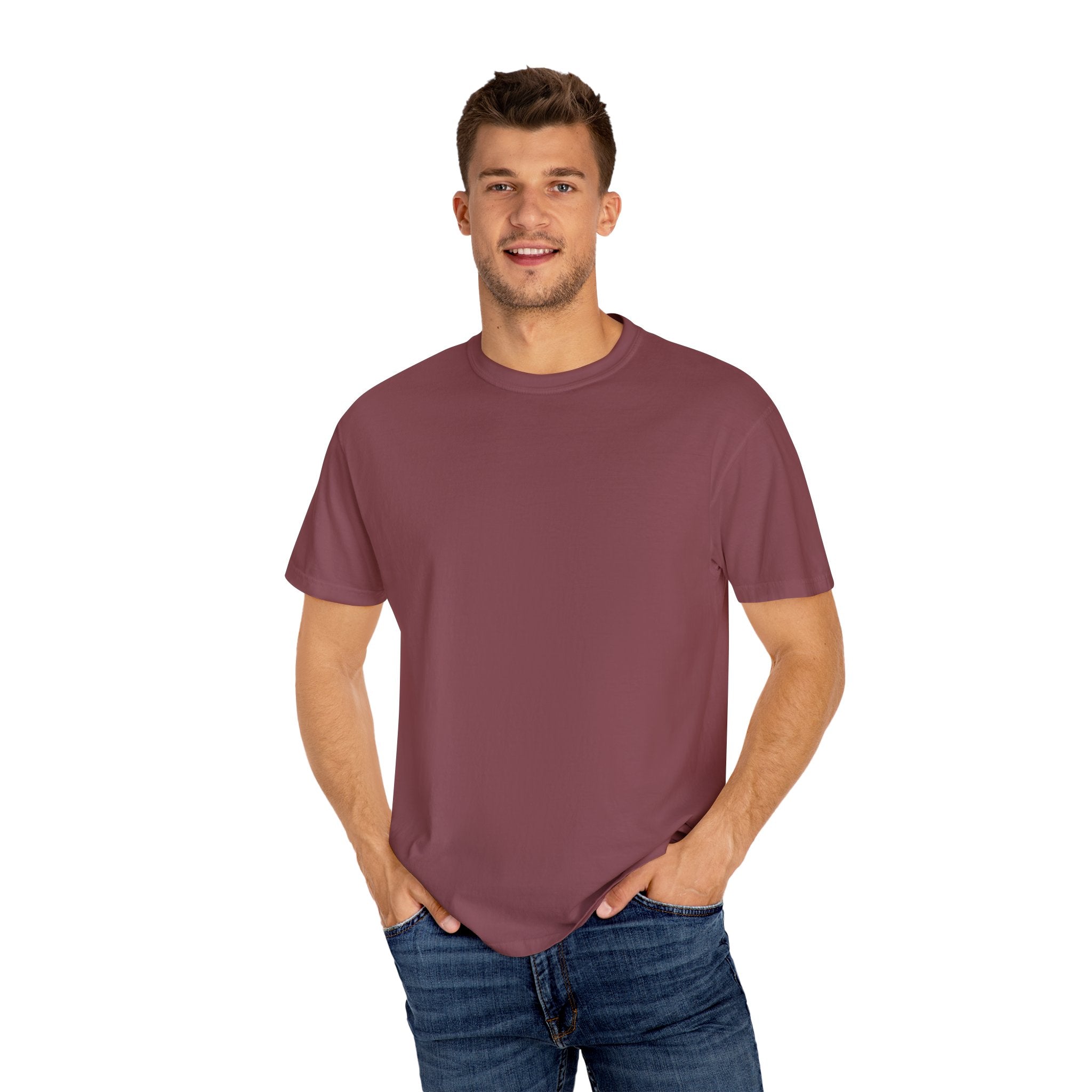 Man wearing a maroon t-shirt and blue jeans on a white background