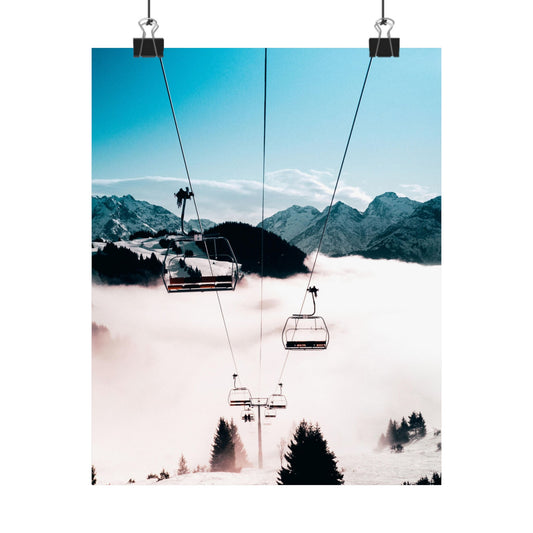 Ski lift with mountains and clouds in the background