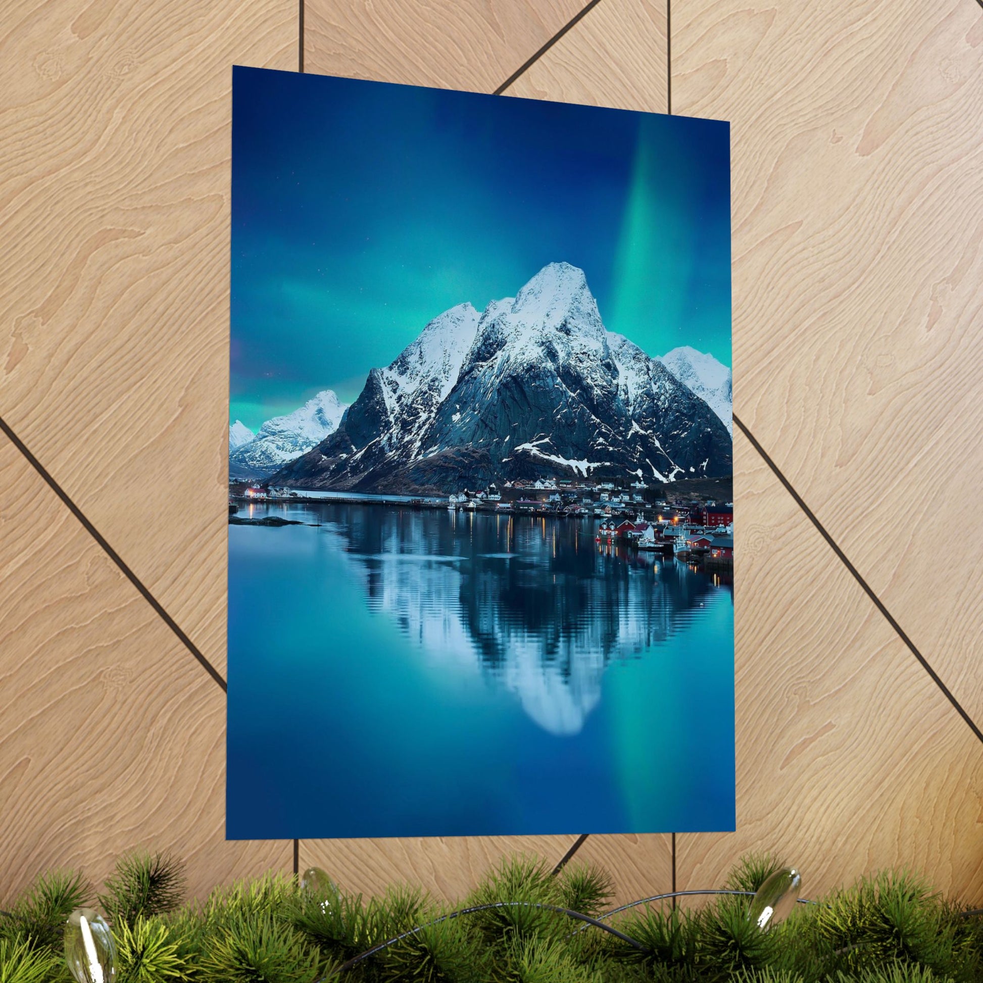 Poster of a mountain landscape with a lake on a wooden surface.