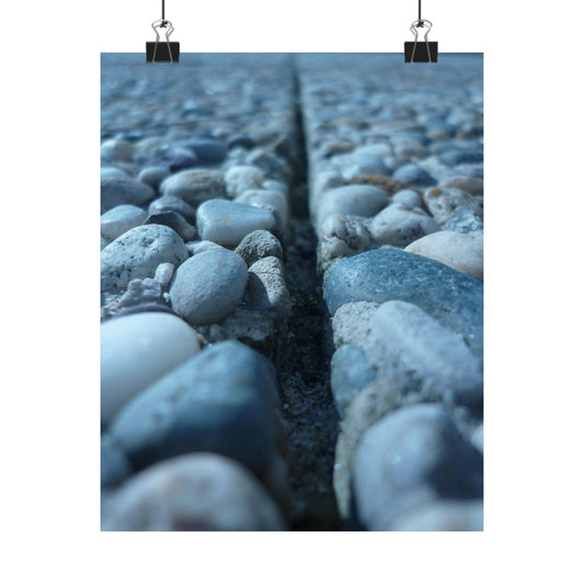 Close-up of pebbles and a crack between them on a white background