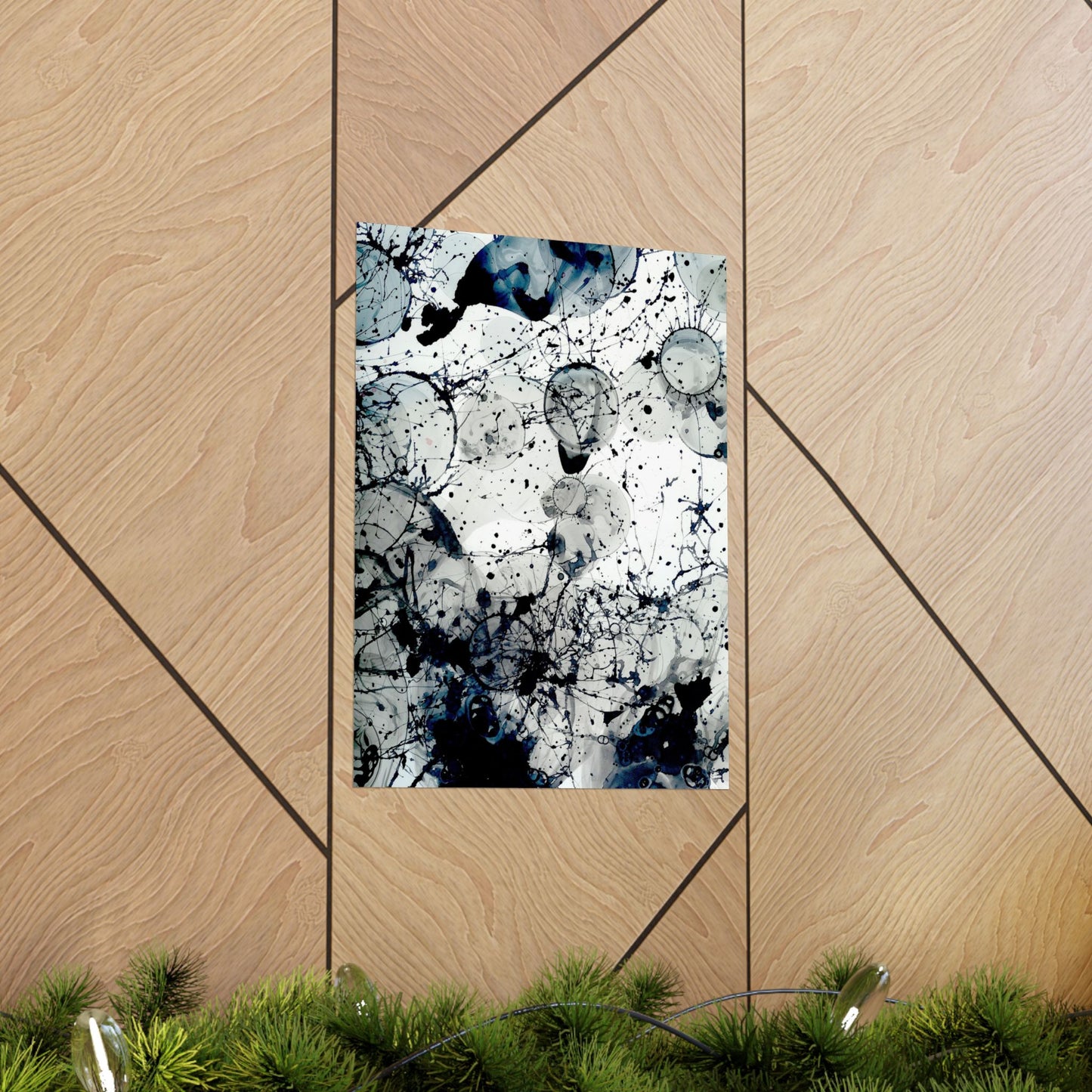 Abstract art print with black and blue splashes on a wooden panel