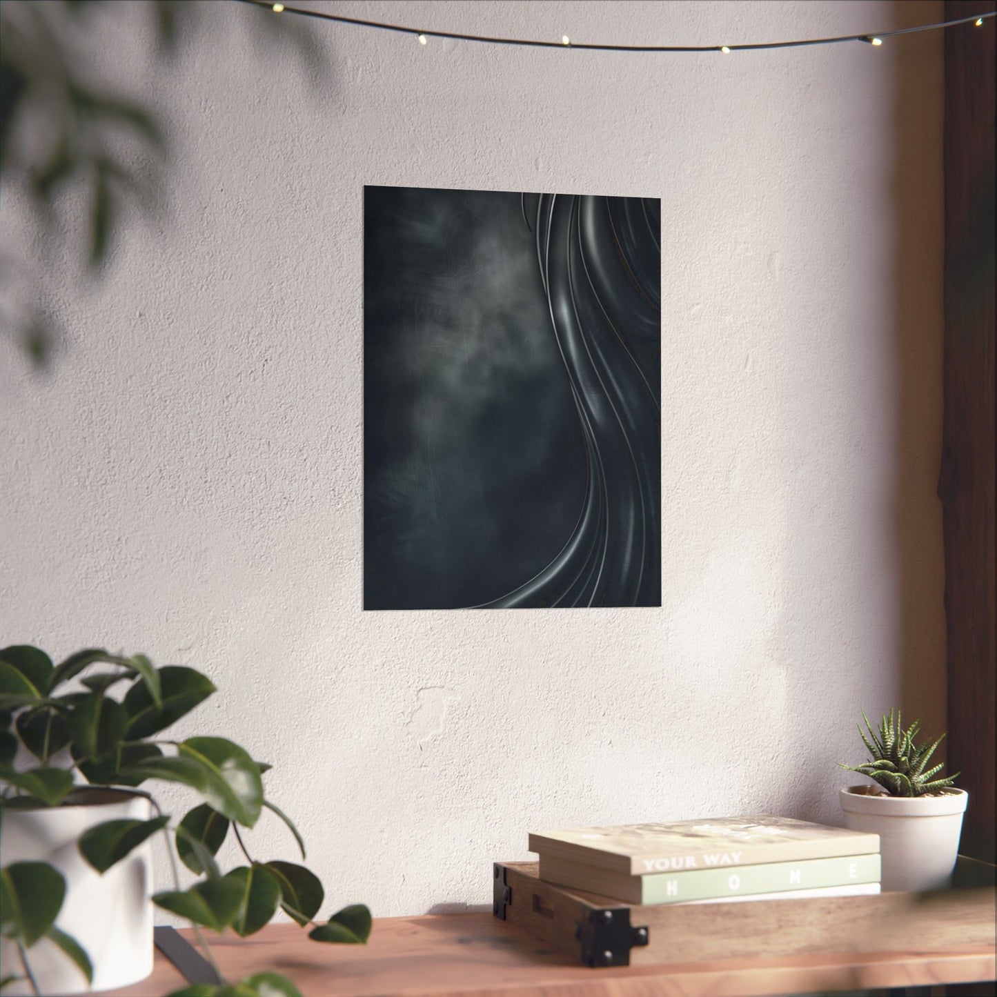Abstract art piece on a wall above a wooden table with plants