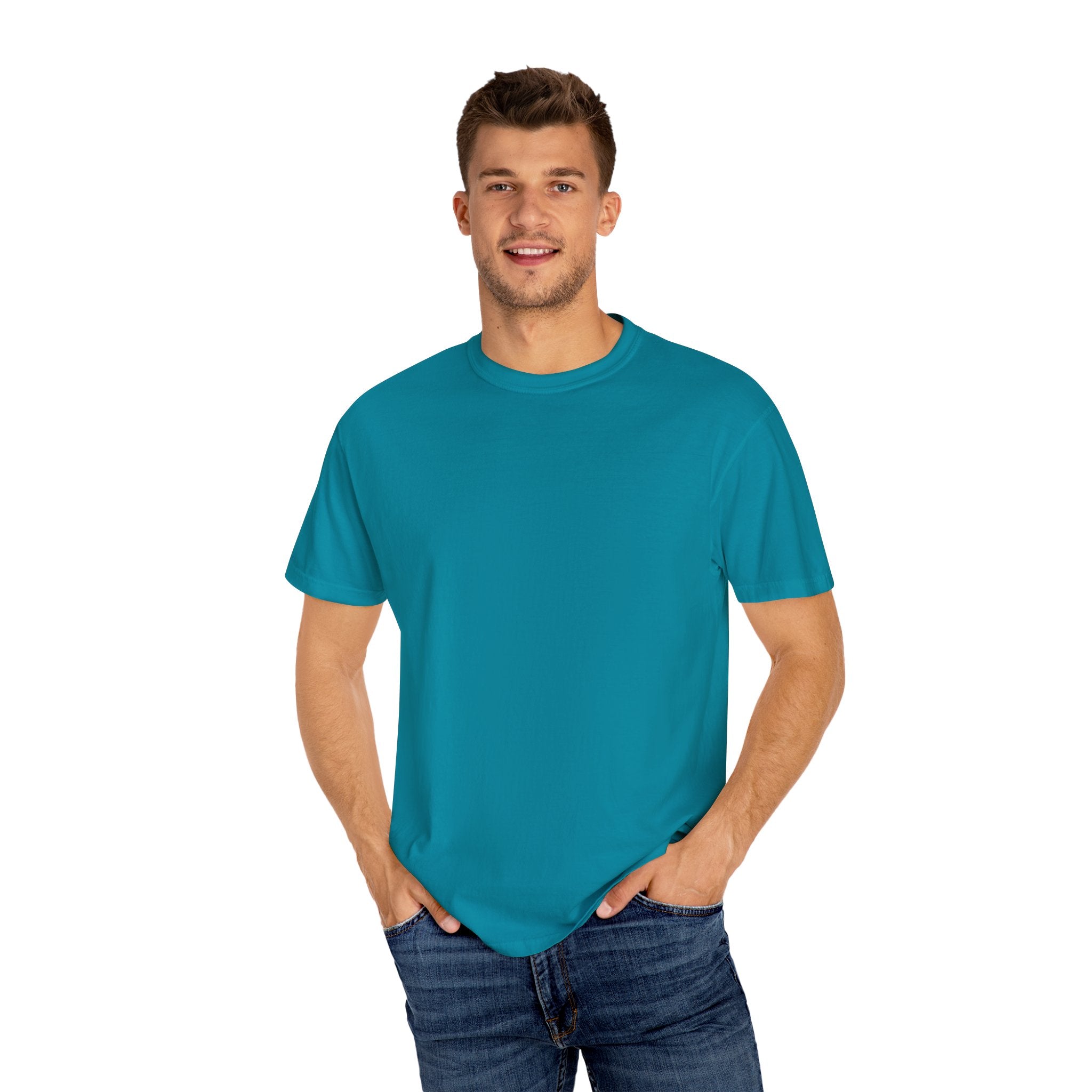 Man wearing a teal t-shirt and jeans on a white background