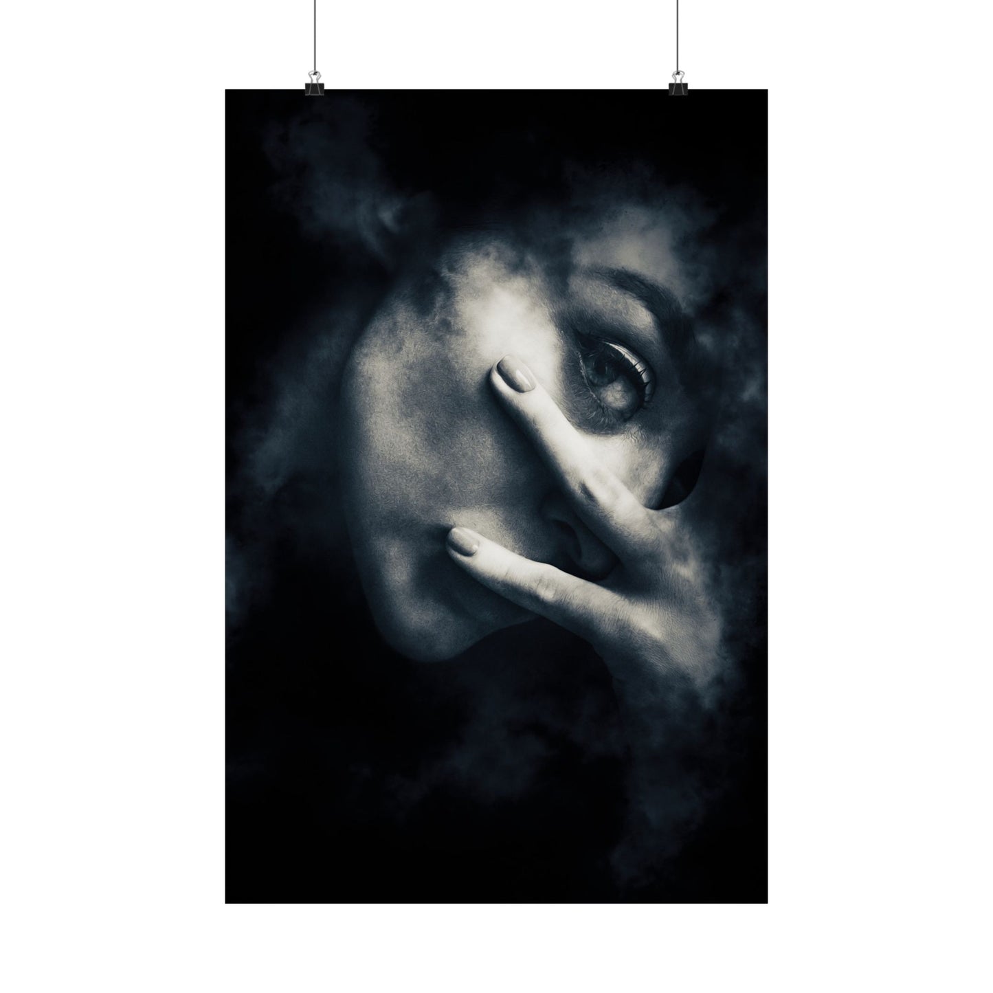 Artistic black and white portrait with a hand covering part of the face on a dark background
