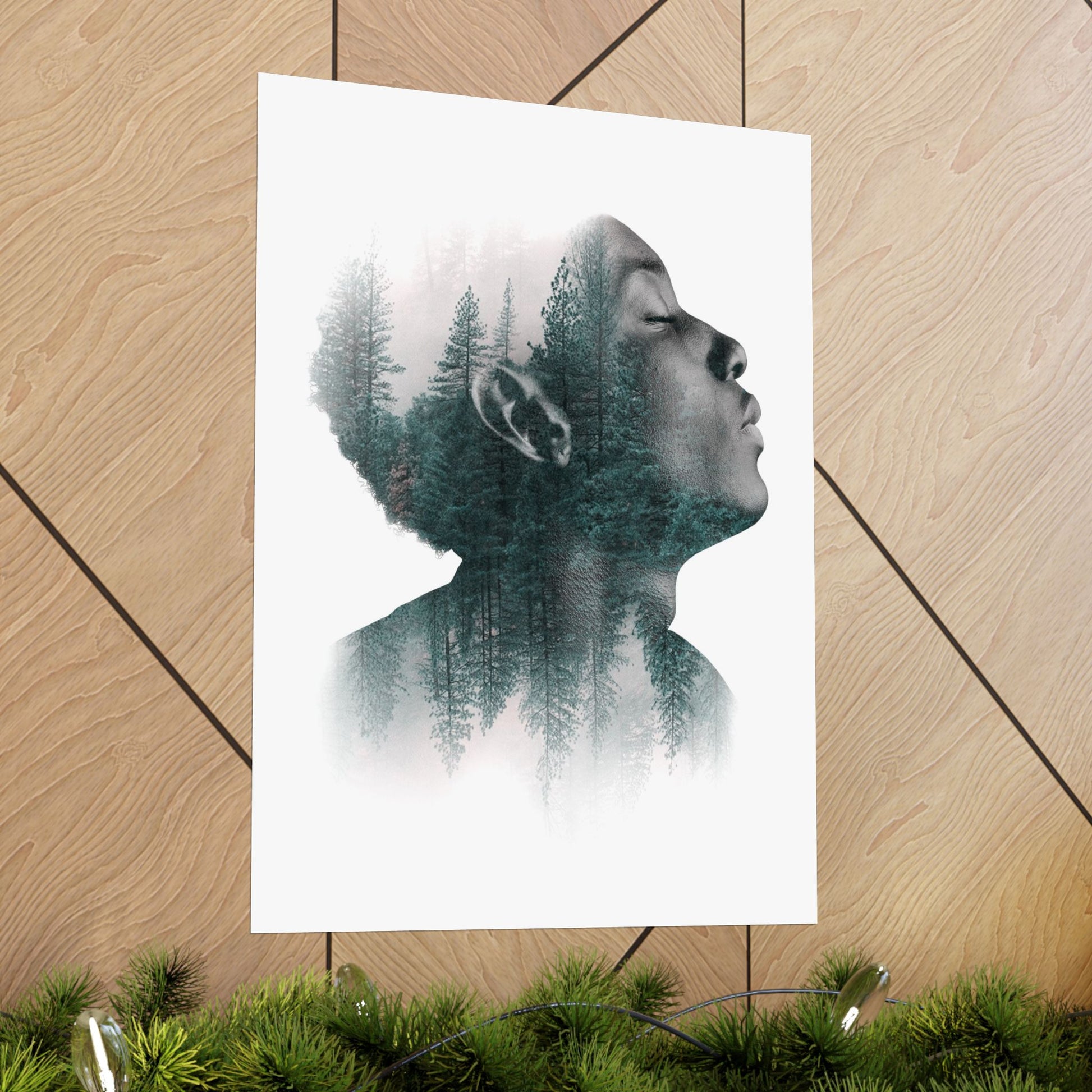 Poster of a double exposure of a person's profile and forest on a wooden floor.
