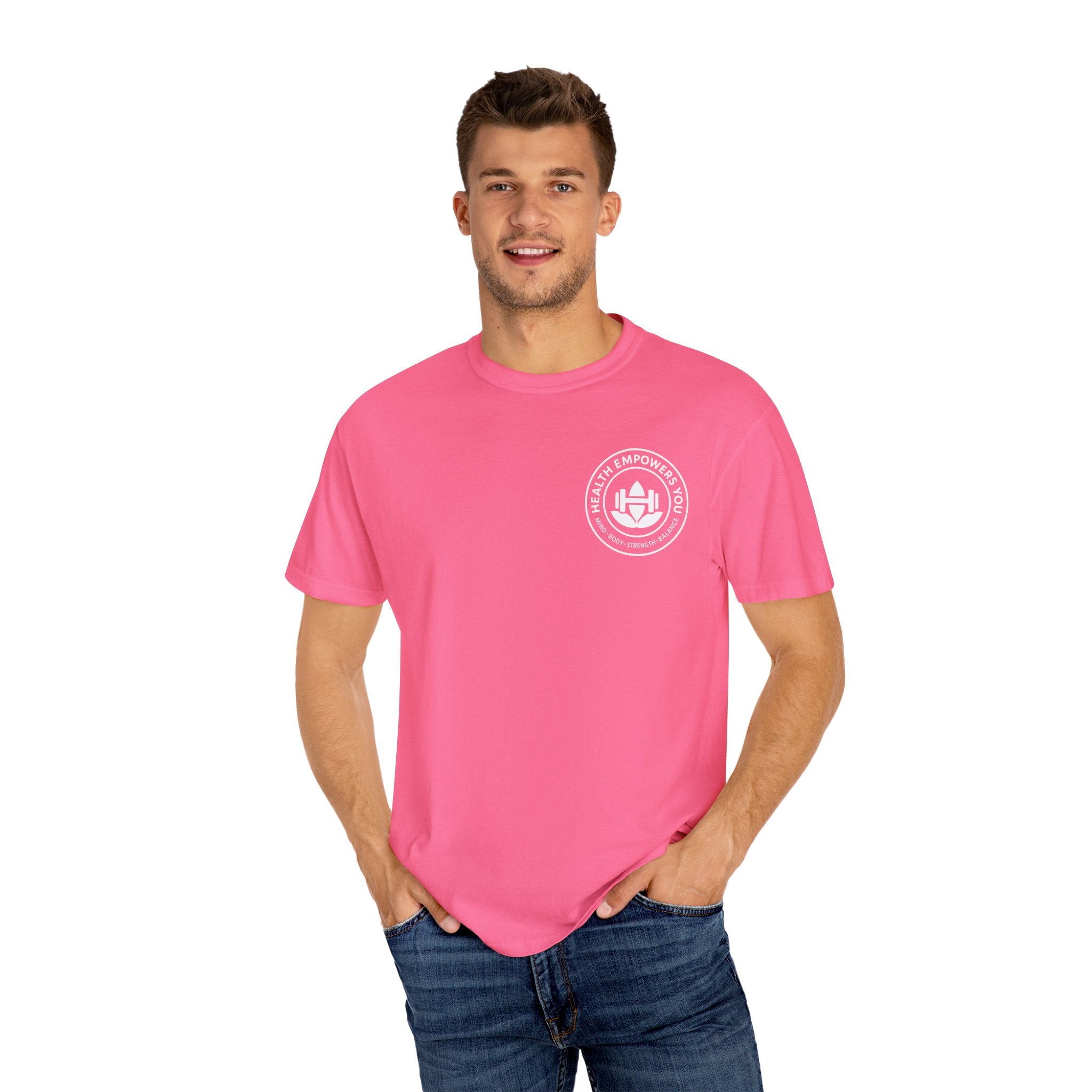 Man wearing a pink t-shirt with a logo on a white background